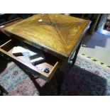 An antique rosewood envelope card table having inlaid decoration