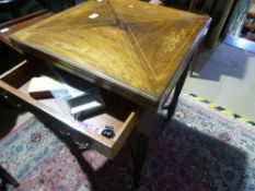 An antique rosewood envelope card table having inlaid decoration