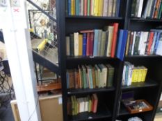 Four shelves of assorted books