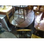 Five Ercol fleur de lys chairs and a table