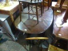 Five Ercol fleur de lys chairs and a table