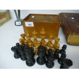Early 20th Century ebony and boxwood chess set in its original case, incomplete - missing 4 knights,