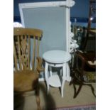 Contemporary circular white bedside table with a drawer and cream painted upholstered head board