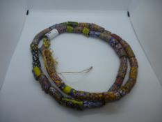 Large string of African hand painted glass beads,