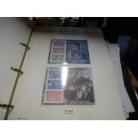 An album of Columbus stamps, 2 albums of WWII stamps and Covers, WWII coins