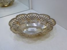 A silver pierced decorative bowl with foliage design rim marked Birmingham 1920 S. Blanekensee and