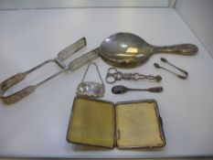 A silver lot comprising of a Martini decanter label, spoon, tongs, mirror and cigarette case gilt