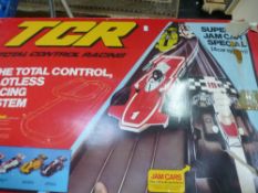 A boxed total controlled racing system which includes 29ft of slotless track, two jam cars and two