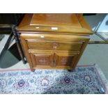 An Oriental style cabinet having one drawer