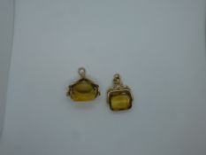 Two yellow metal pendant seals each holding a large citrine, marks undistinguishable