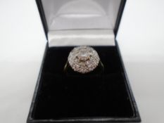 18 carat gold diamond cluster ring with a central diamond approx 0.5 carat diamond - gross weight