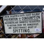 Cast iron spitting sign