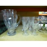 A set of 6 etched wine glasses with jug