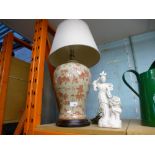 An oriental design table lamp and an oriental figure