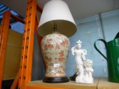 An oriental design table lamp and an oriental figure