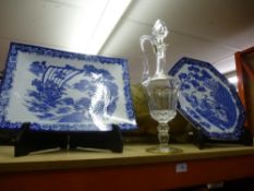 Two blue and white chargers, alongside a cut glass Claret decanter