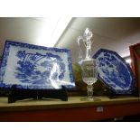 Two blue and white chargers, alongside a cut glass Claret decanter