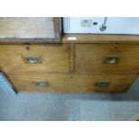 A chest of small proportions having two over one drawers