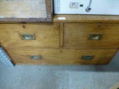 A chest of small proportions having two over one drawers