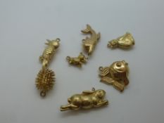 Seven 9ct yellow gold charms, to include a hedgehog, rabbit, fish, bird, etc, marked 375, approx 9g