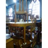 A set of six vintage teak dining chairs by Nathan, to include a pair of carvers and a similar
