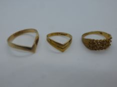 Three 9ct yellow gold rings, including a knot design ring, all marked 375, the largest size T, total