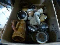 A box of mixed drinking vessels, including Studio pottery, wood and metal materials