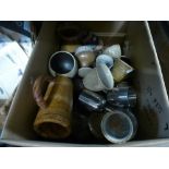 A box of mixed drinking vessels, including Studio pottery, wood and metal materials