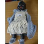 A black plaster doll fully dressed rare as not many were made in the 1960