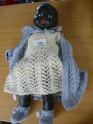 A black plaster doll fully dressed rare as not many were made in the 1960