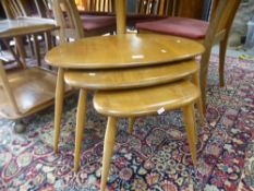A nest of three Ercol pebble tables