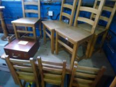 A pine oblong kitchen table on square chamfered legs