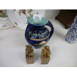 A blue glazed double handled vase, with decorative design on a cobolt blue background, AF, and two