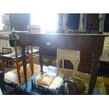 An oak side table and painted chest of drawers having three drawers