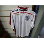 A signed 2007-2009 England shirt by John Barnes, together with a Liverpool shirt signed by John