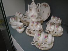 A quantity of Royal Albert 'Moss Rose' teaware and dinner plates