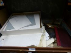 A case of mixed ephemera, books, pictures