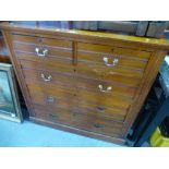 A late Victorian satin walnut chest of drawers on plinth base and an antique foldover table