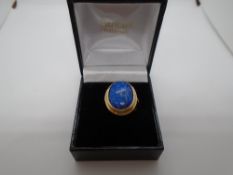 9 carat gold ring with blue stone, possibly Lapis Lazuli