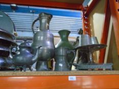 A collection of Pewter items, to include a large flagon, tankards, teapot, etc