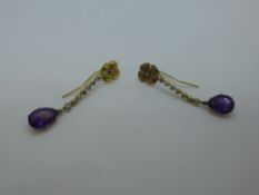 Pair of yellow metal drop earrings with flower head with central diamond chip, paste drops and a