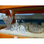 A quantity of cut glass items to include bowls, candlebra, preserving pot, perfume bottle, etc