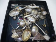 Silver and Silver plated lot including spoons, pins, decanter label, badge, thimbles, etc