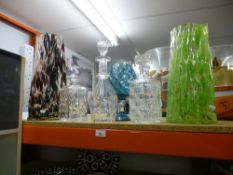 Two art glass vases alongside 3 cut glass decanters, etc