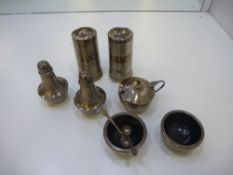 A silver lot comprising of salt and pepper shakers and salts, bowl all hallmarked. Including