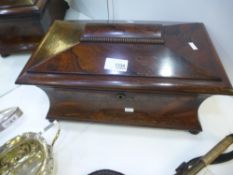 A Victorian rosewood tea caddy of sarcophagus shape