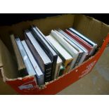 A box of hardback books, of mixed themes