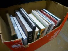 A box of hardback books, of mixed themes