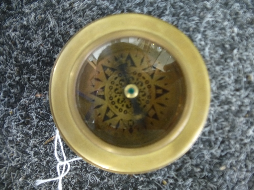Compass with magnifying glass