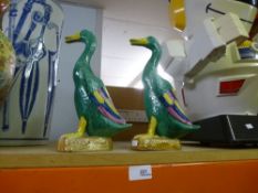A pair of oriental ducks, one with markings on base